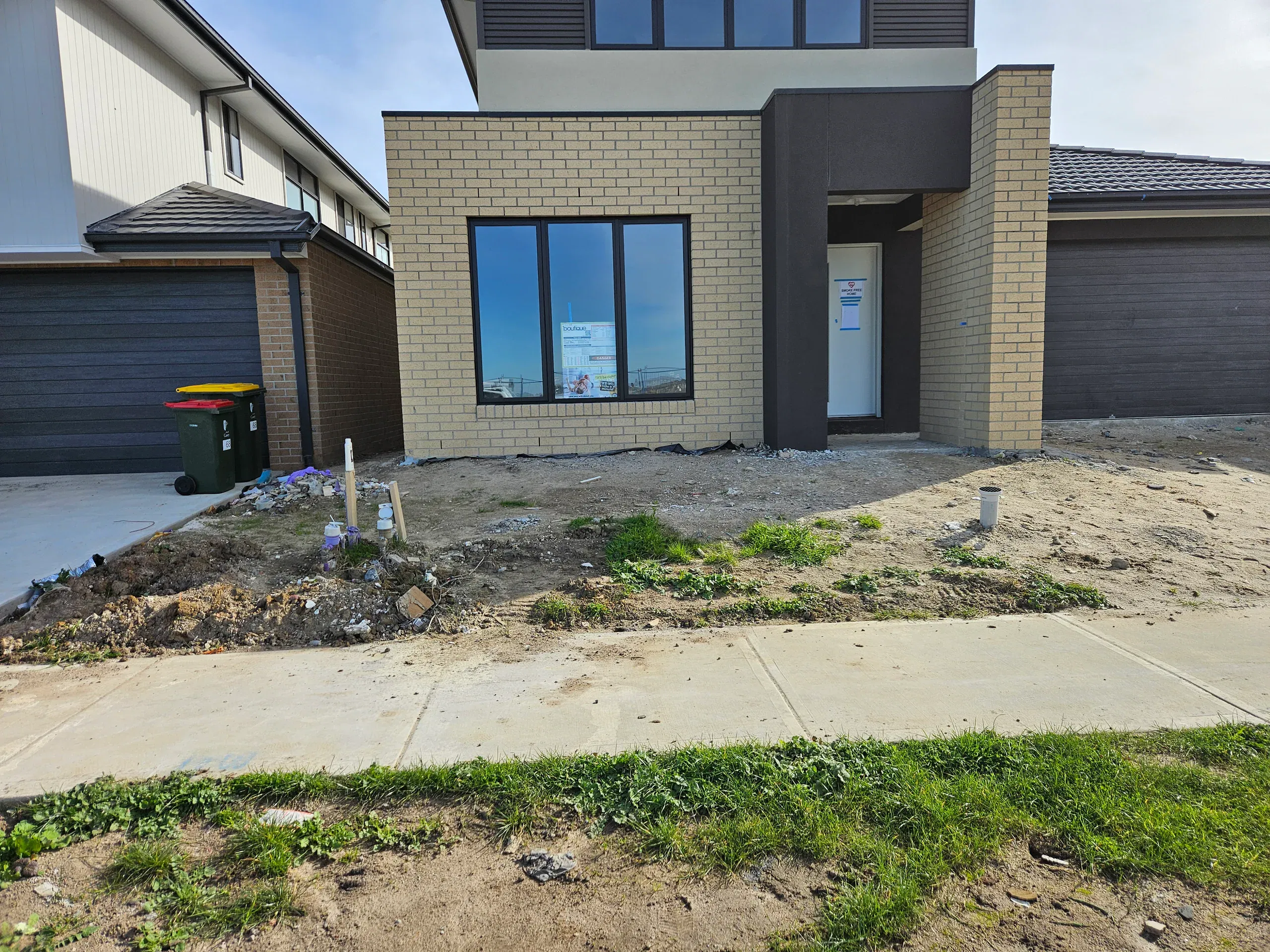 Clyde front-yard landscaping — retaining beds and turf