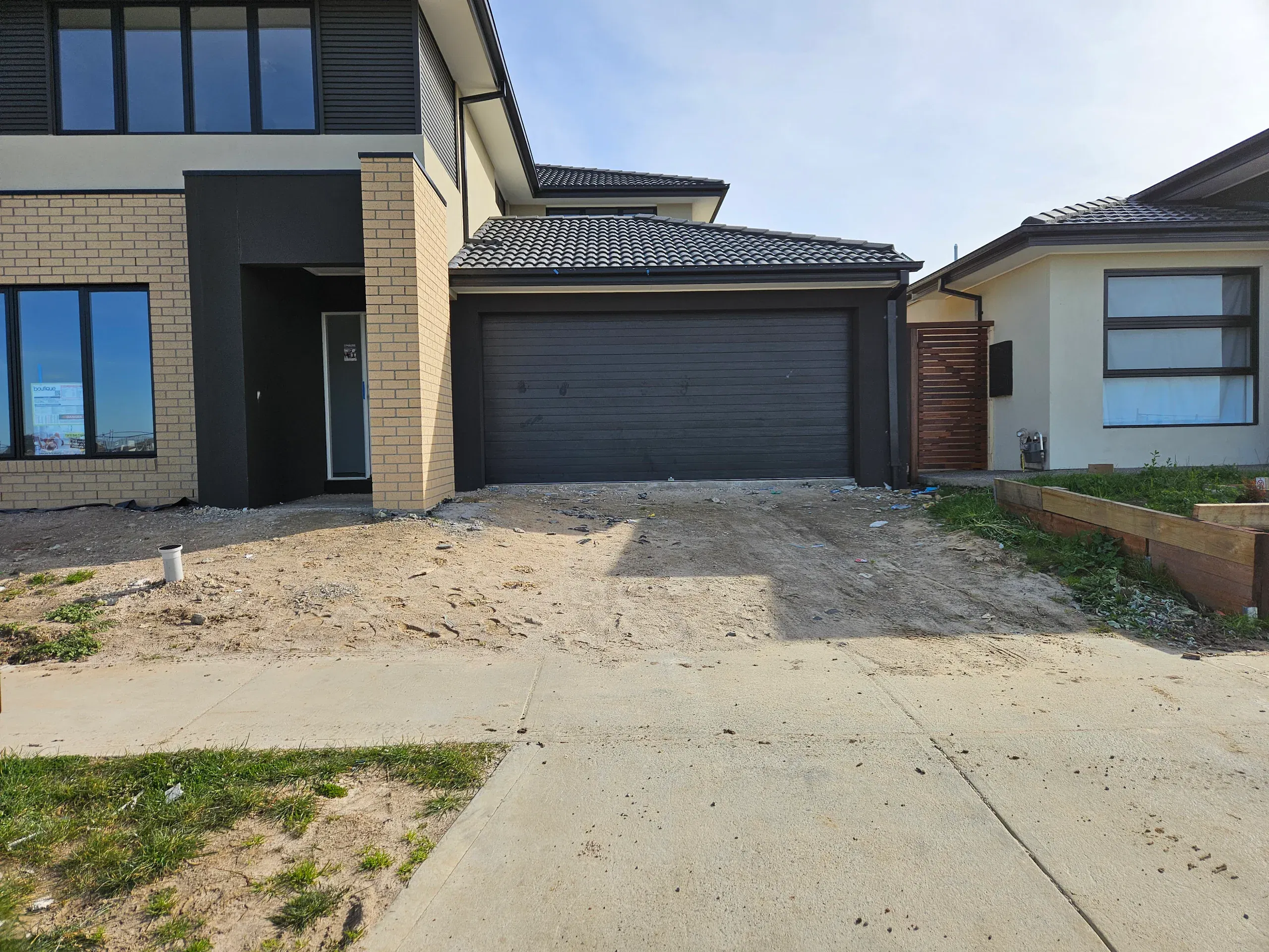 Clyde front-yard landscaping — retaining beds and turf