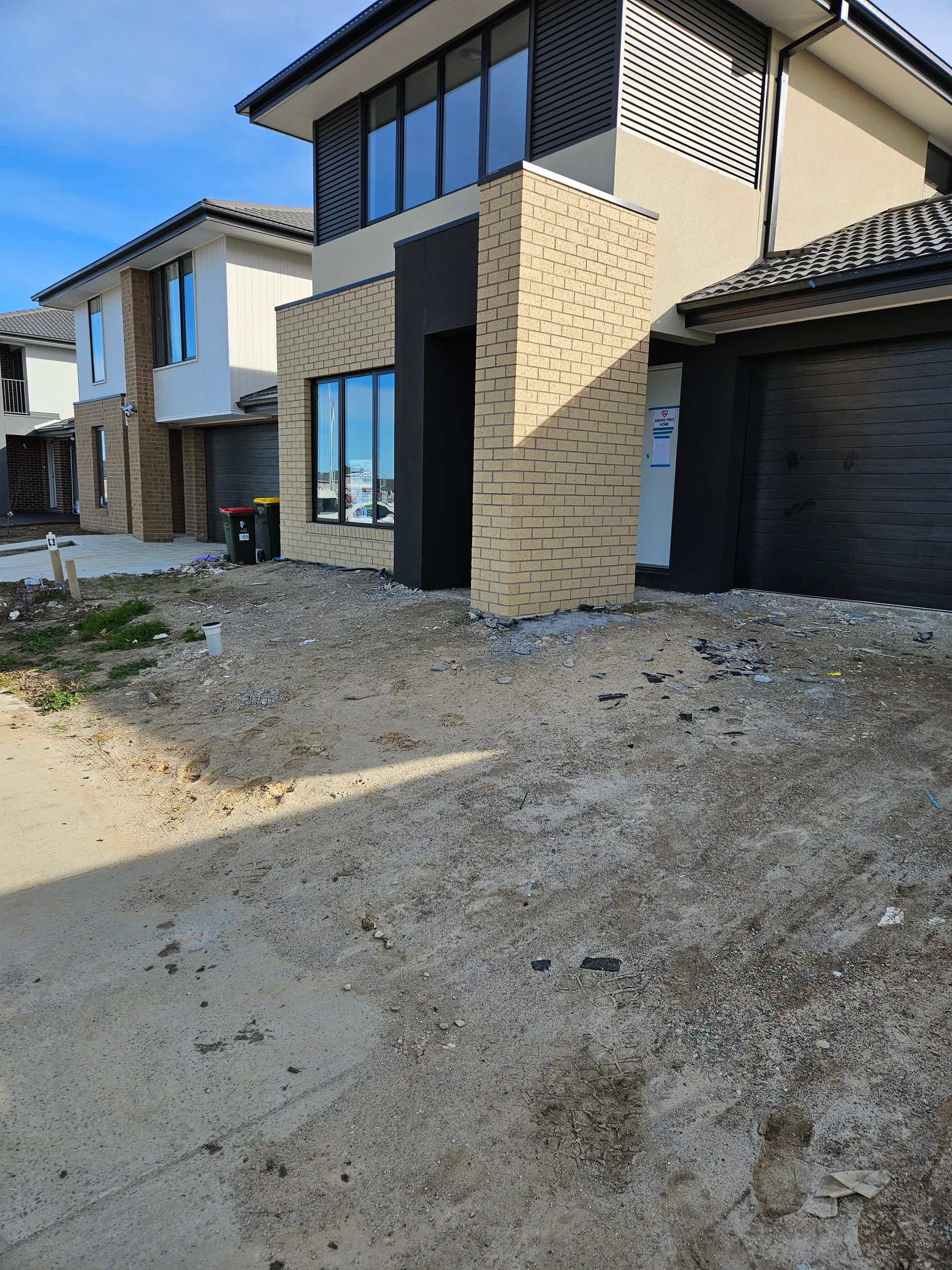 Clyde front-yard landscaping — retaining beds and turf