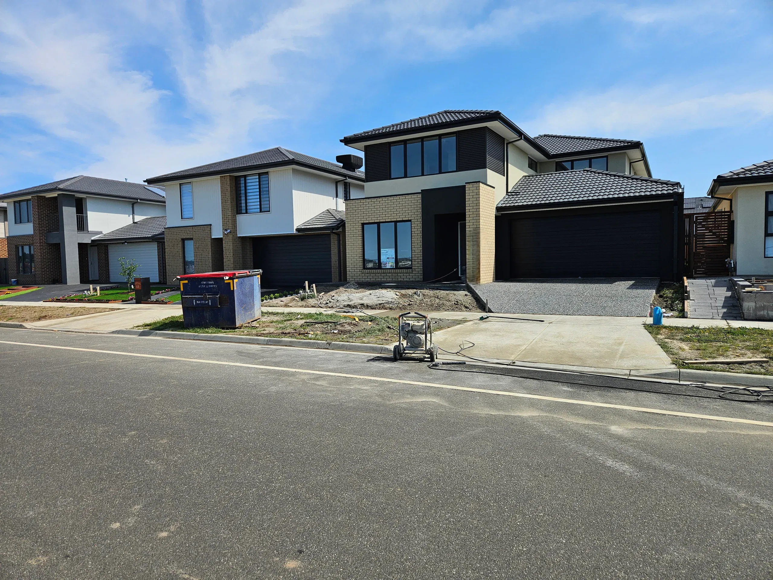 Clyde front-yard landscaping — retaining beds and turf