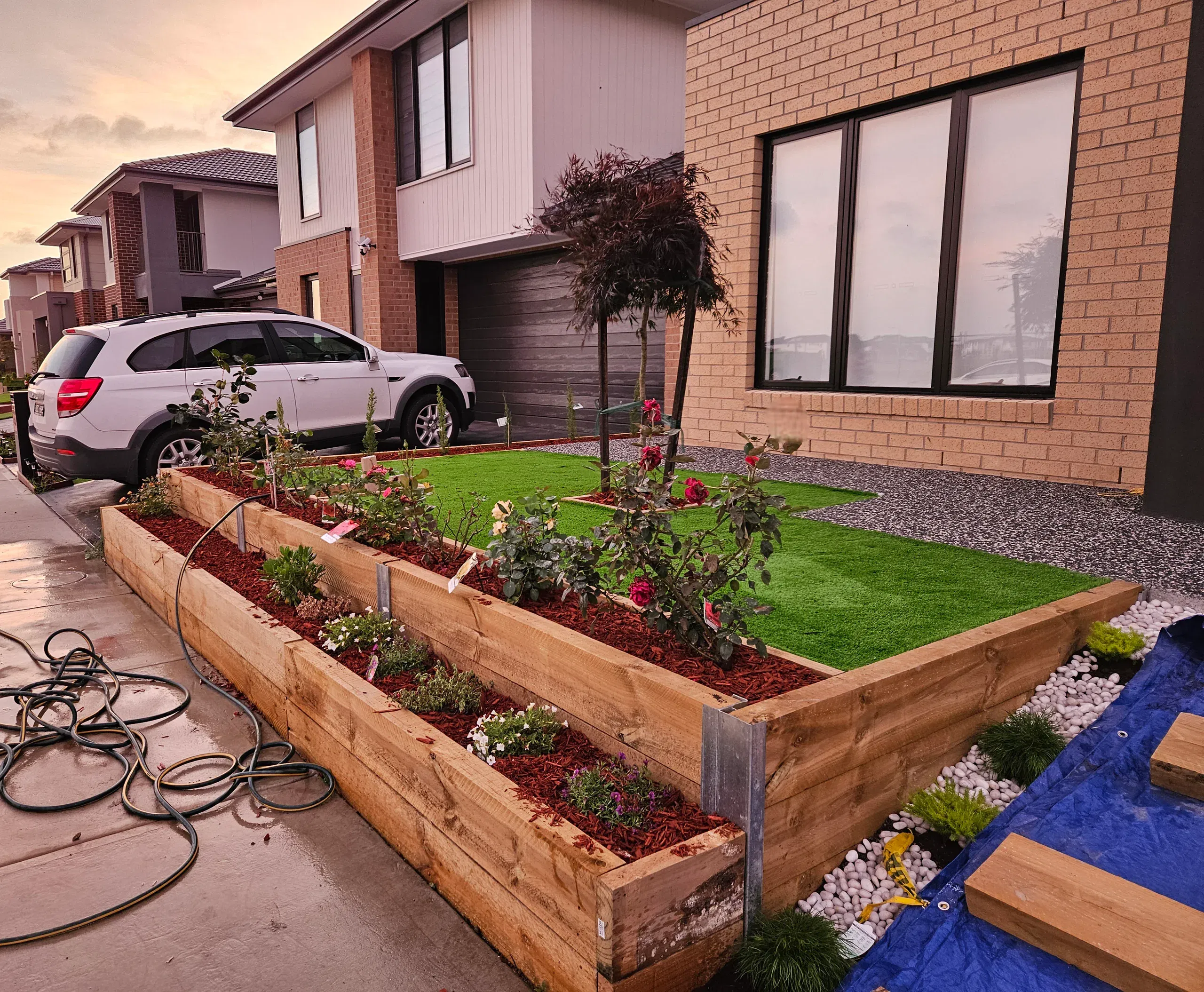 Clyde front-yard landscaping — retaining beds and turf