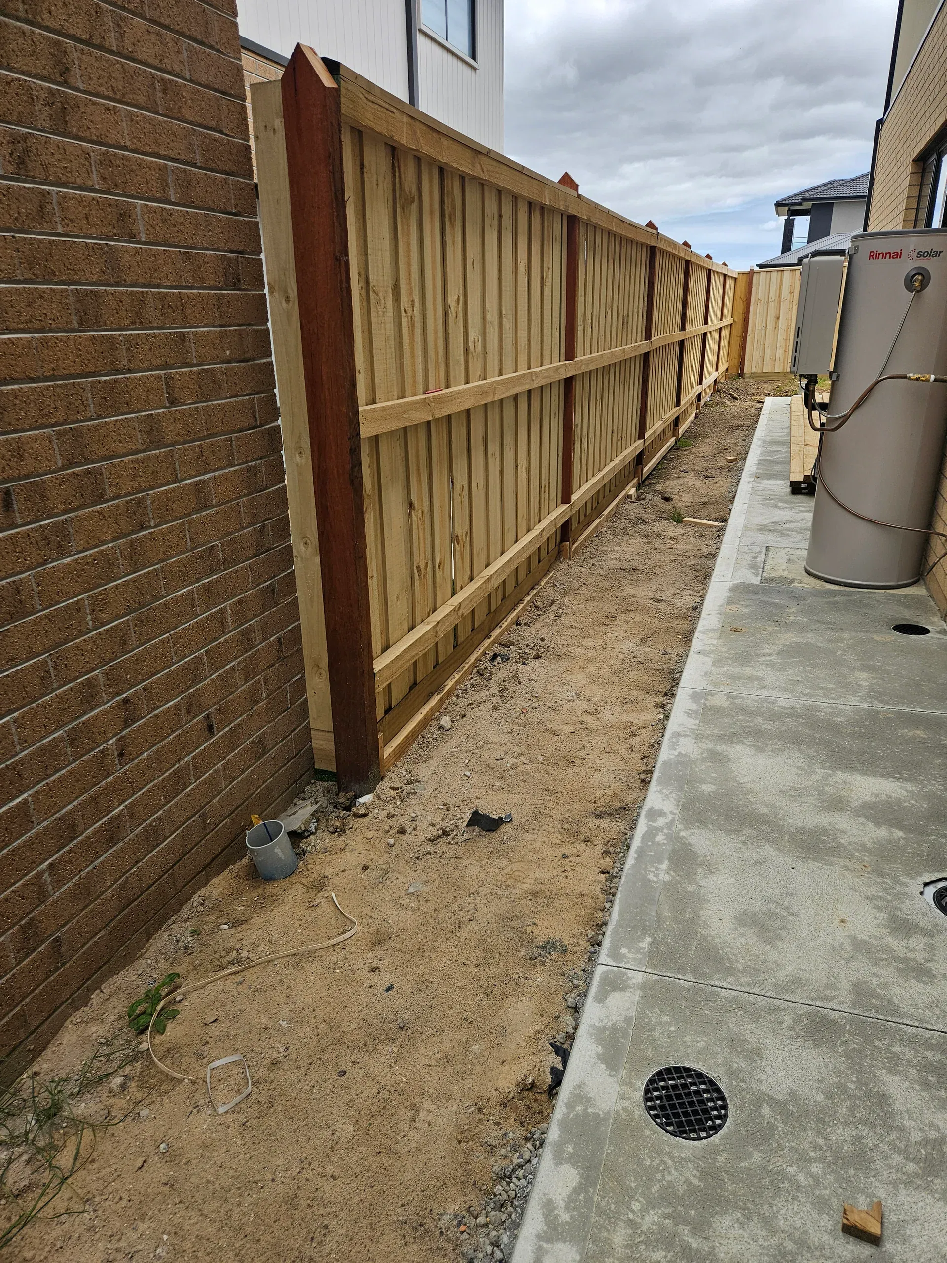 Timber paling fencing installation