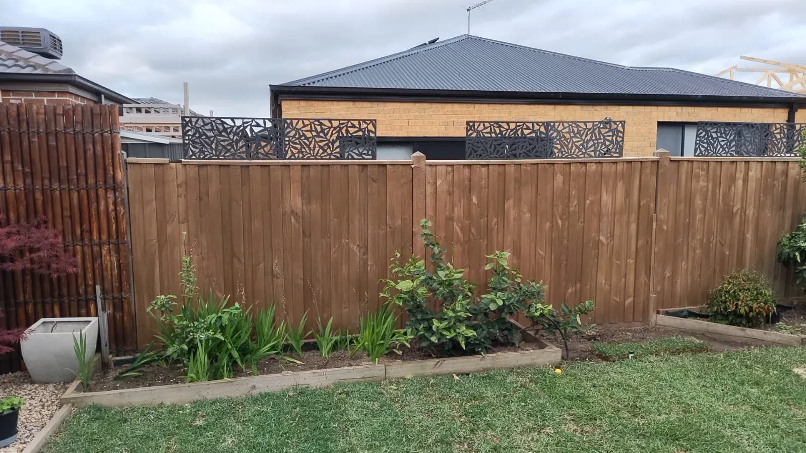 Fence extension with matching palings and topper