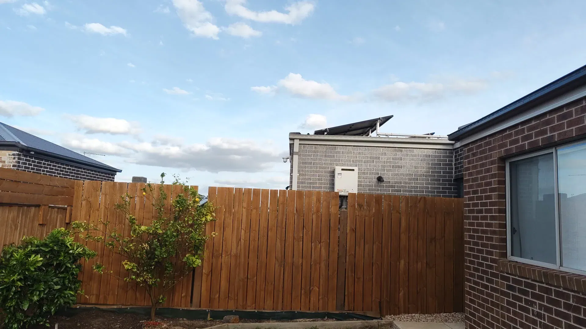 Fence extension with matching palings and topper