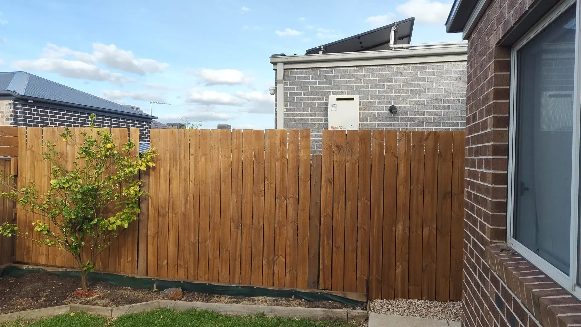 Fence extension with matching palings and topper