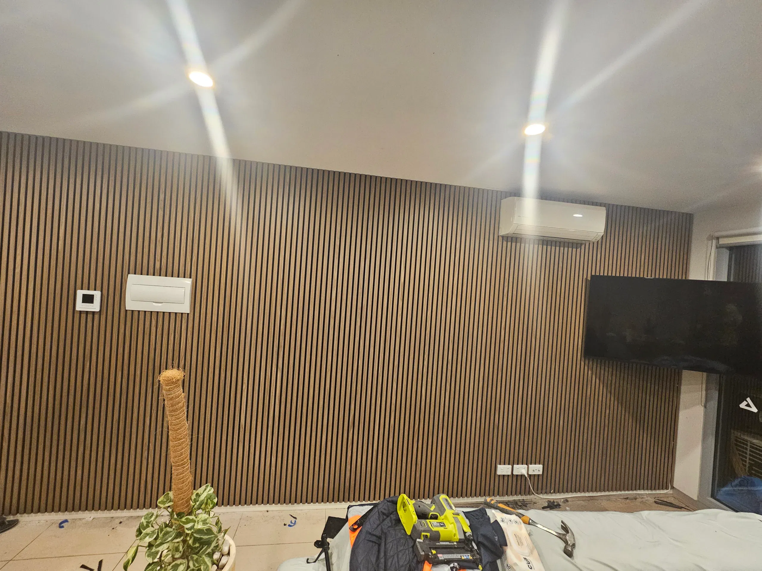 Timber-slat interior cladding feature wall