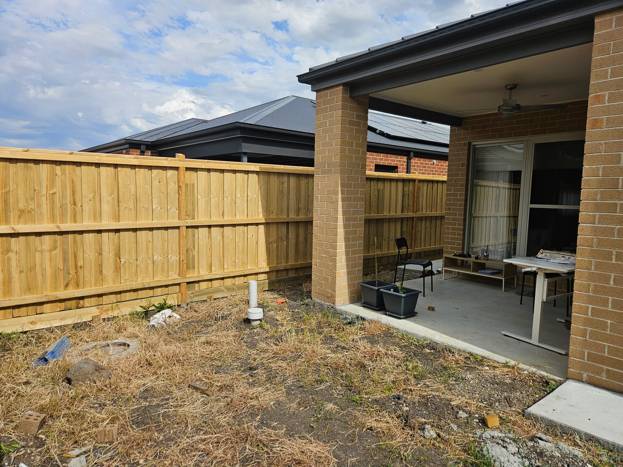 Wollert deck with steps, planters and new lawn