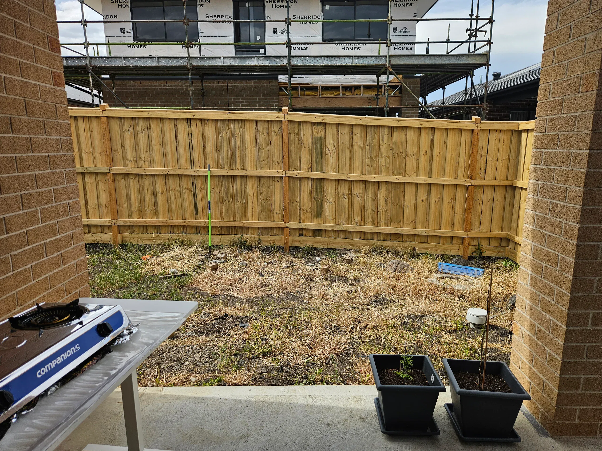 Wollert deck with steps, planters and new lawn