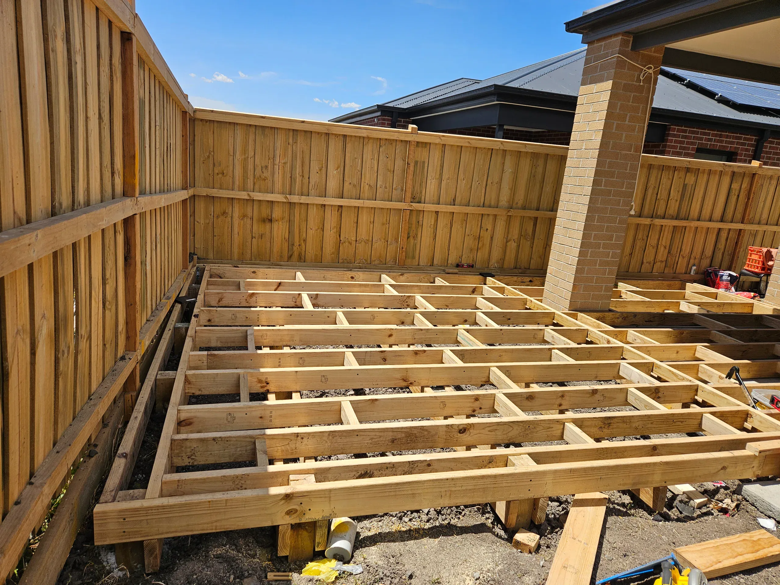 Wollert deck with steps, planters and new lawn