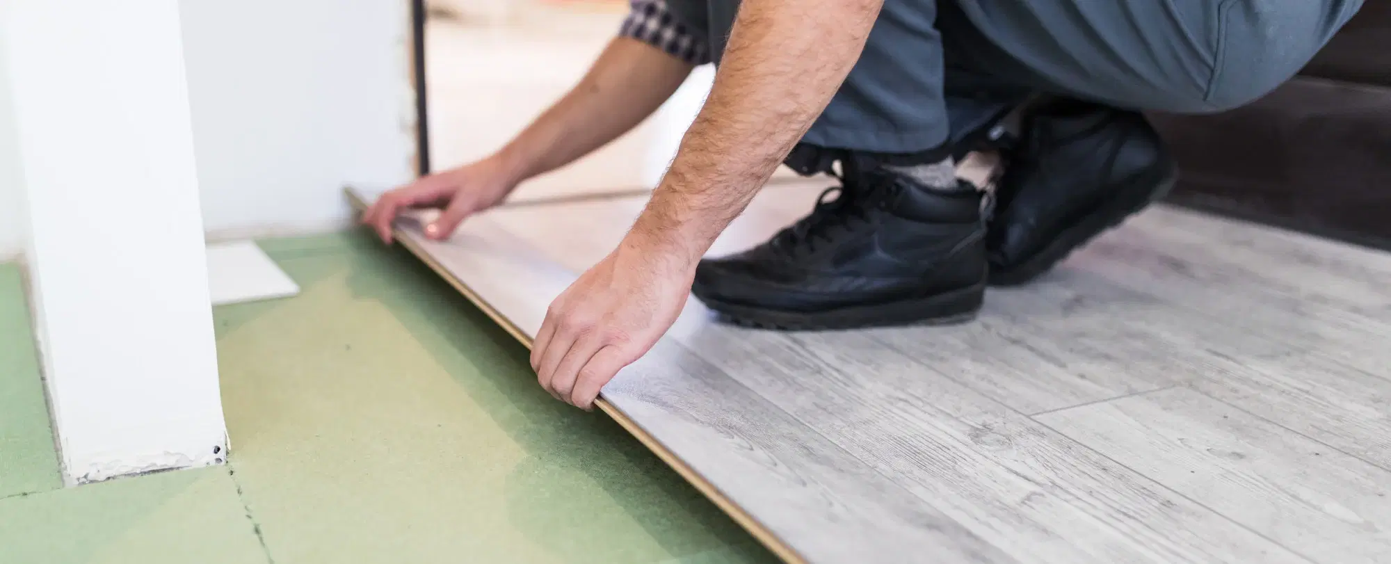 Newly laid timber-look flooring running through an open living space