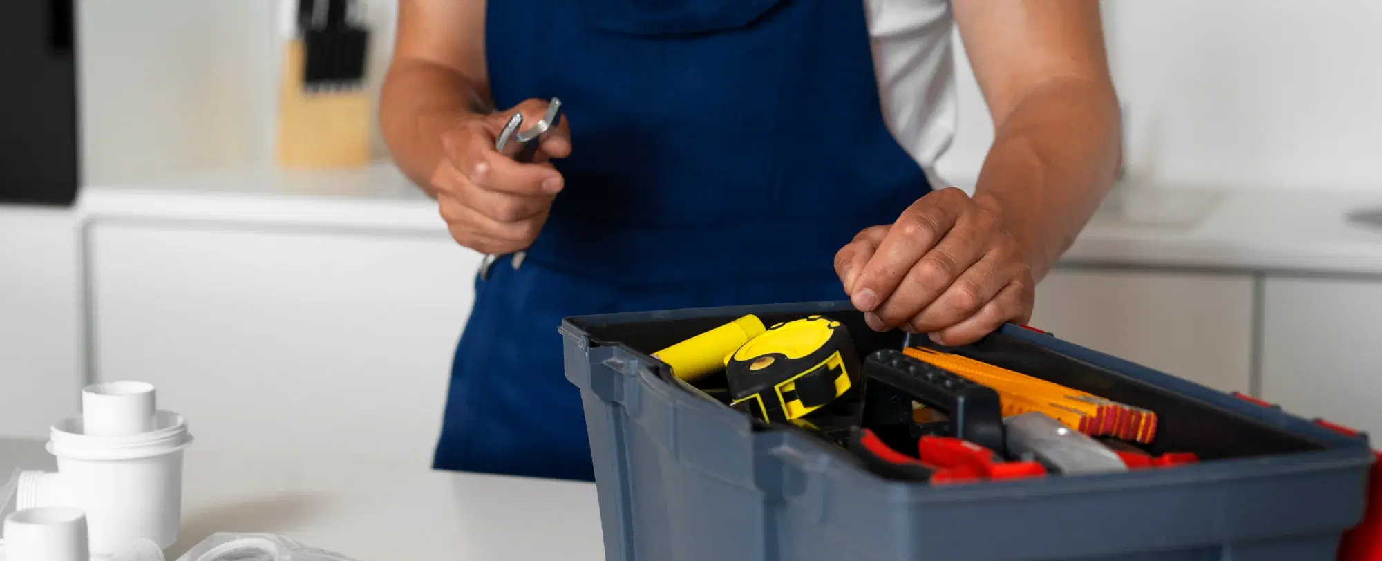 A CoreCraft tradesperson carrying out a household repair